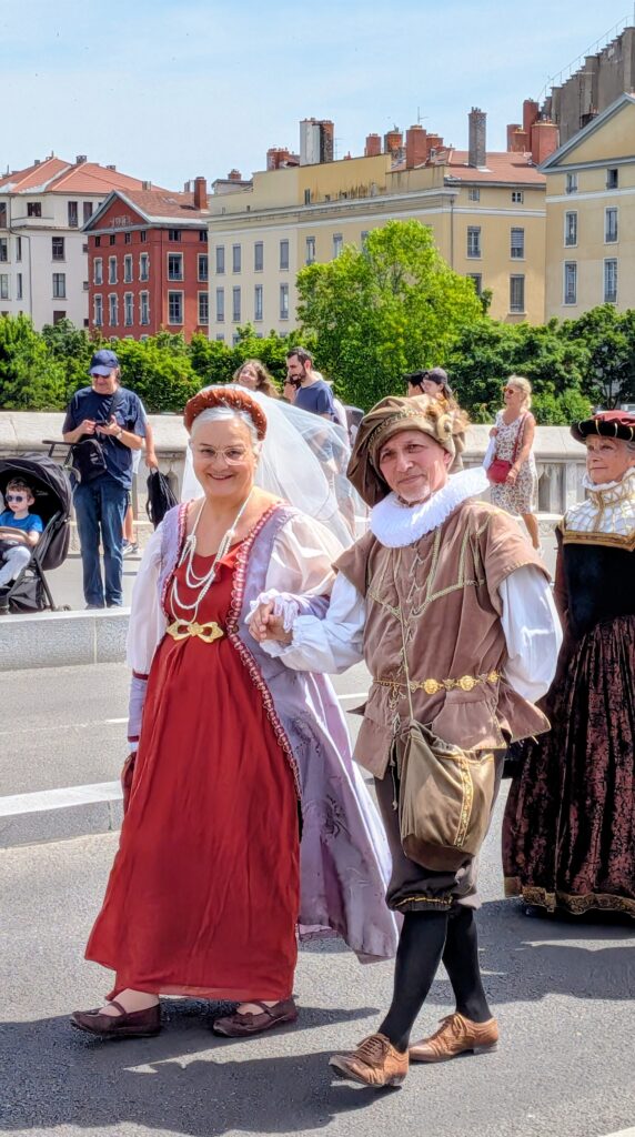 Renaissance festival parade Lyon old town bridge