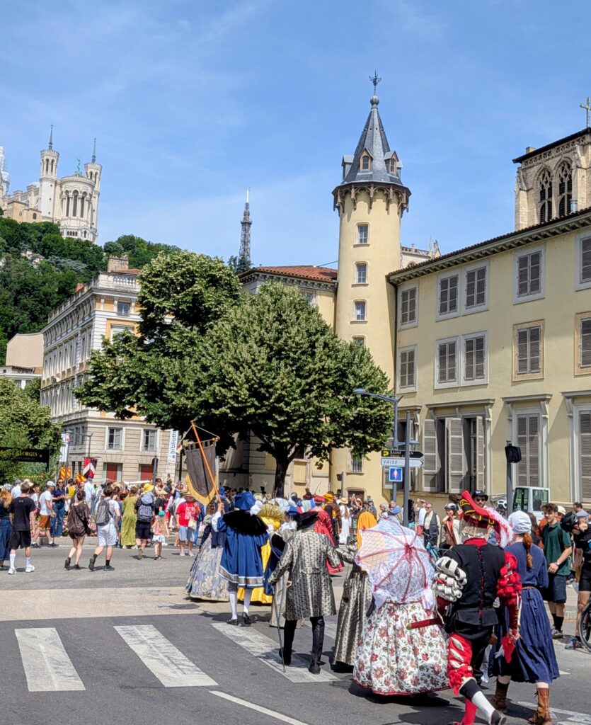 Renaissance festival parade Lyon old town bridge