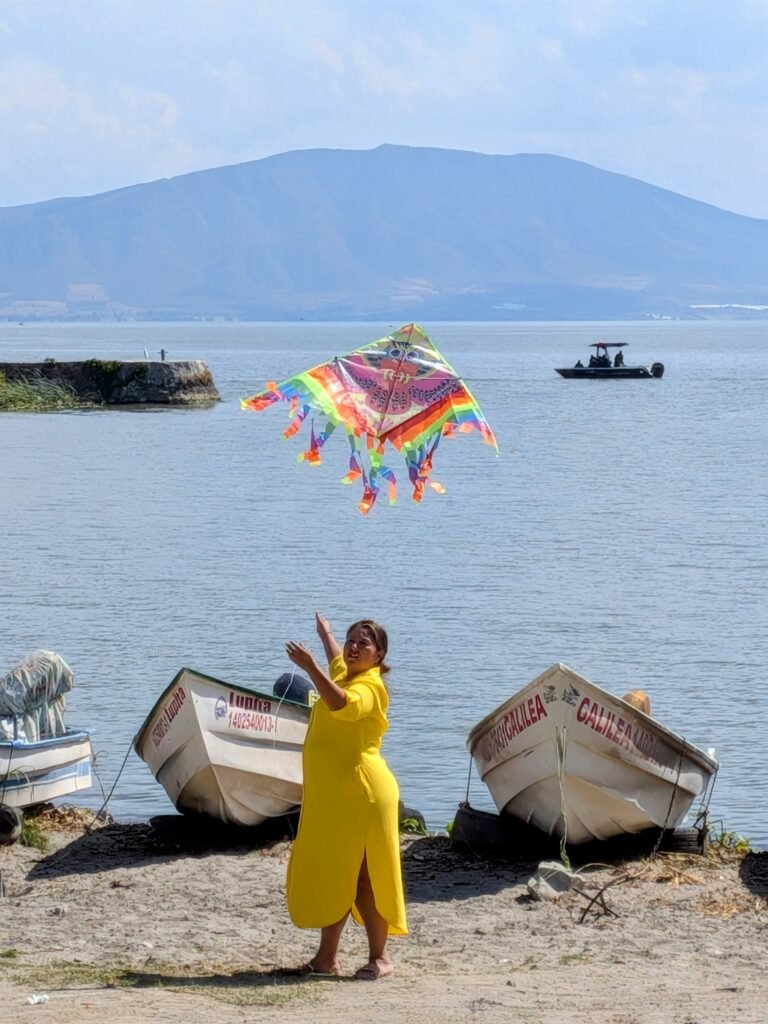 Women flying kite Lake Chapala
